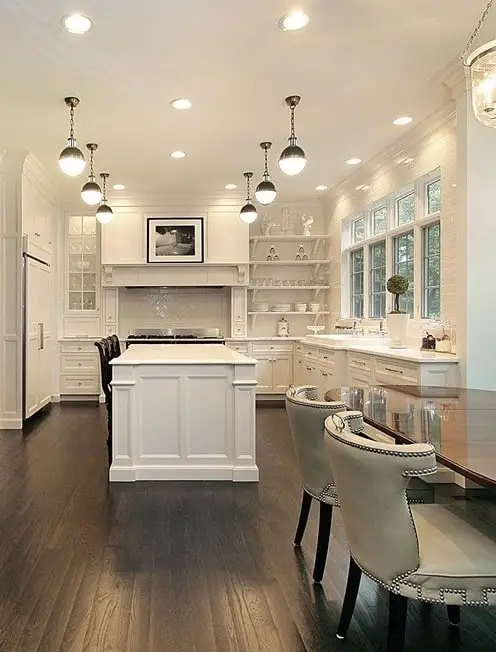 How far apart should pendant lights be over an island in the kitchen: White kitchen with 6 pendant lights 