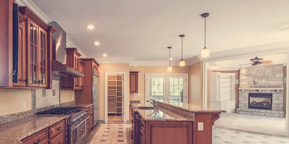 How far apart should pendant lights be over an island in the kitchen fi