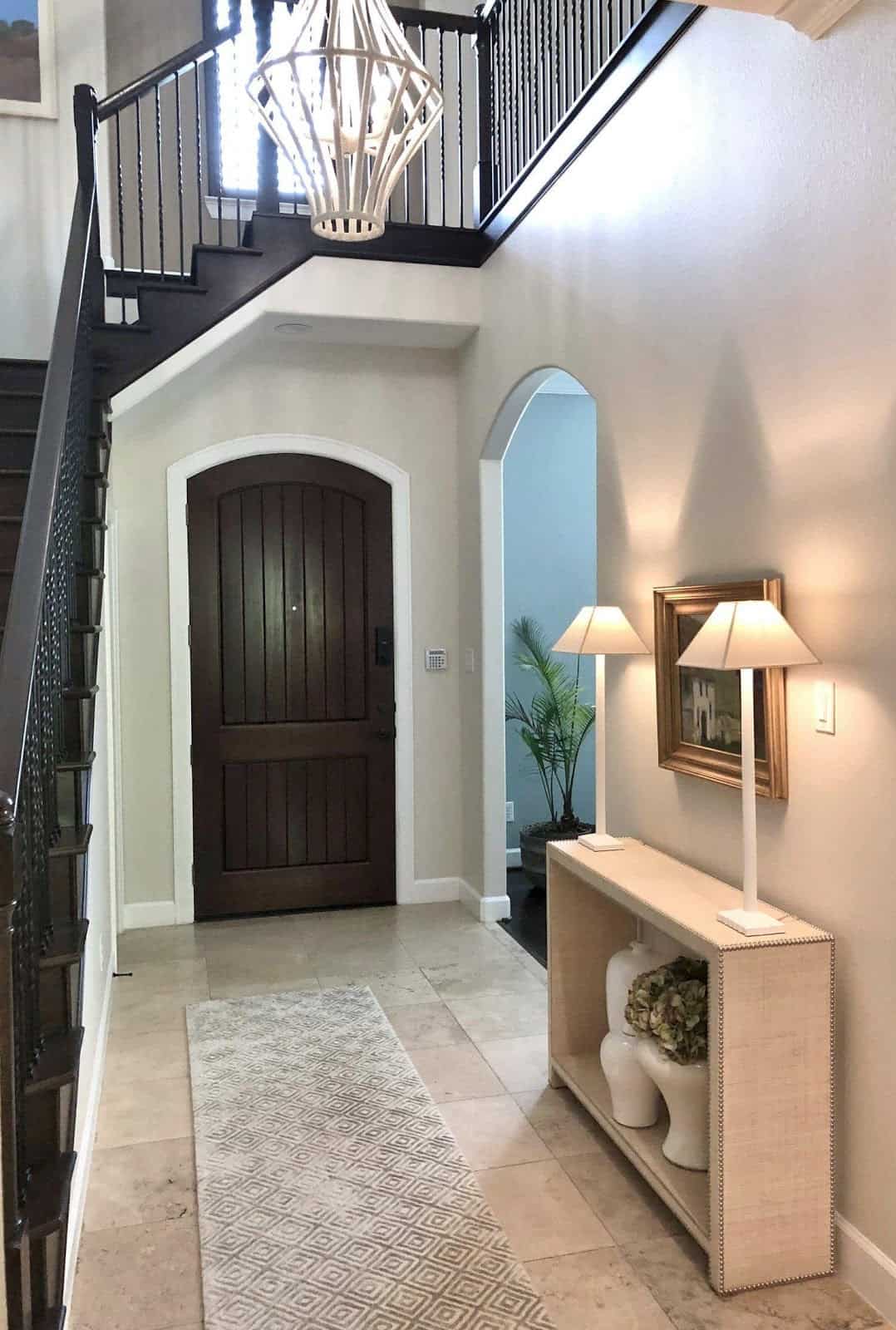 house entrance door below the stairs to the 2nd floor