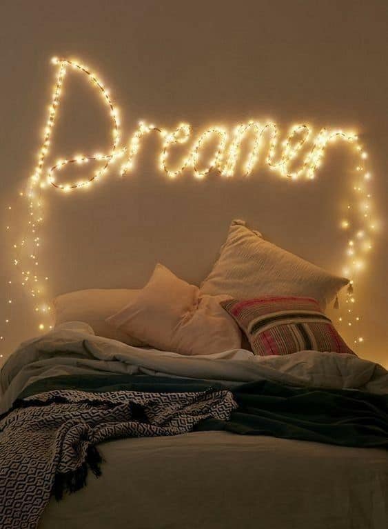 A writing on a wall with LED string lights #ropeLights #lighting #lights #ledLights #stringLights #homeDecor #interiorDesign